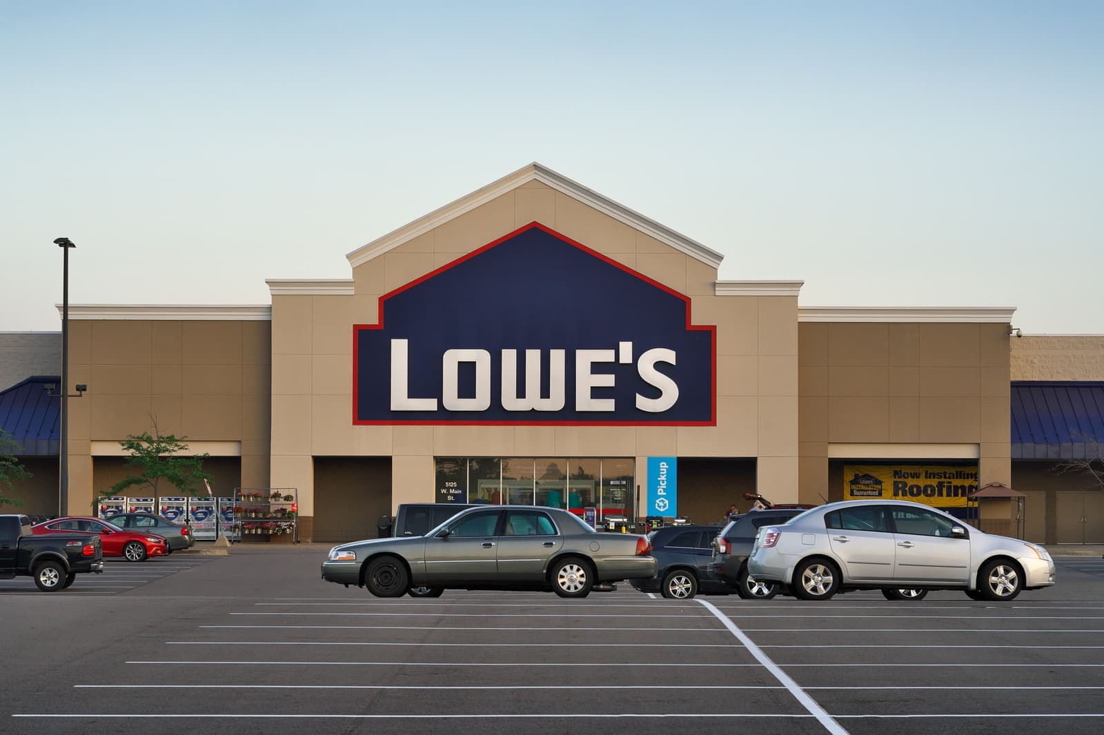 The exterior of a big box store and its parking lot