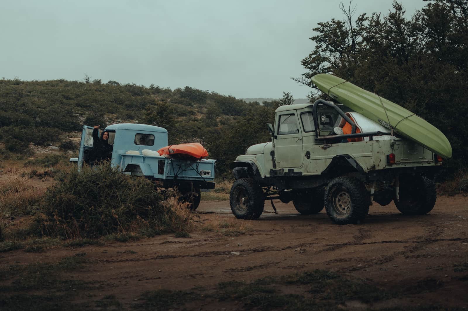 A kayak deck loaded with gear on the shore